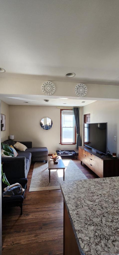 living area featuring dark wood-style flooring