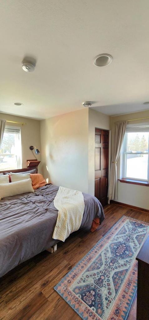 bedroom featuring a closet and wood finished floors