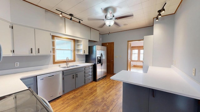 kitchen with plenty of natural light, a ceiling fan, appliances with stainless steel finishes, and a sink