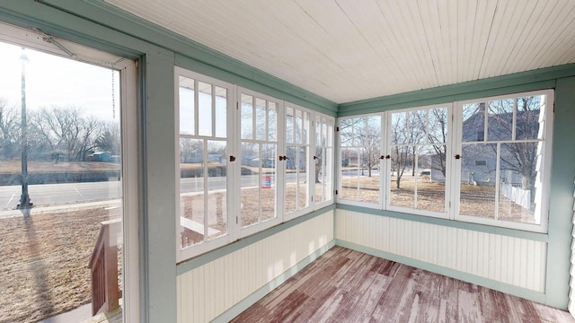 unfurnished sunroom with wood ceiling