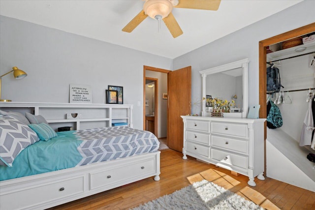 bedroom with a closet, light wood-style flooring, and ceiling fan