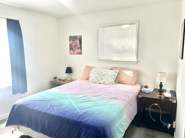 bedroom with wood finished floors