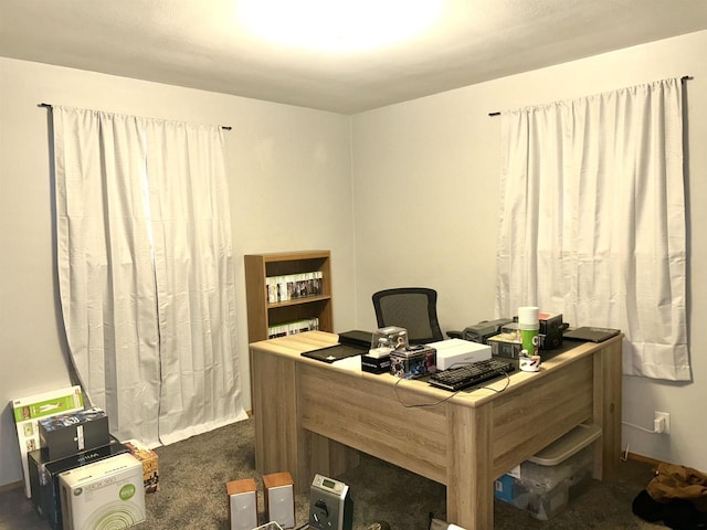 office area with dark colored carpet