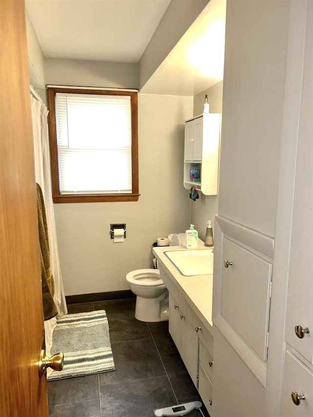 full bathroom with a shower with curtain, toilet, tile patterned flooring, baseboards, and vanity