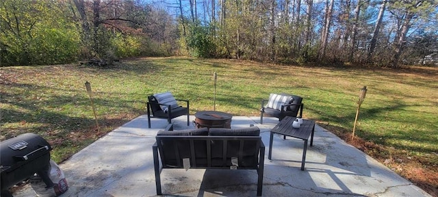 view of patio featuring grilling area and an outdoor fire pit