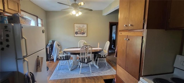 dining area featuring light wood-style floors and a ceiling fan