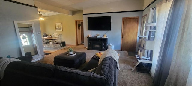 carpeted living area featuring a fireplace