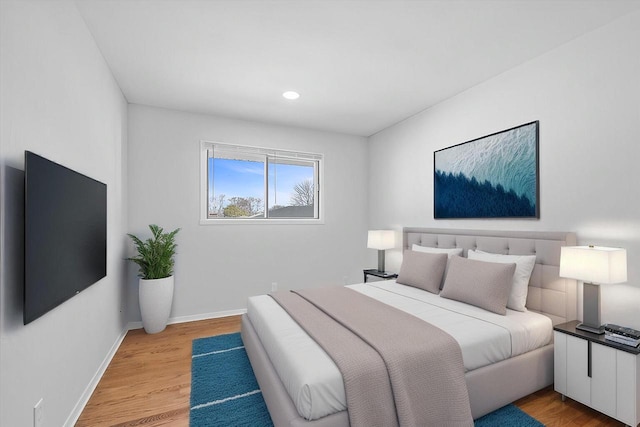 bedroom with light wood-style flooring, recessed lighting, and baseboards