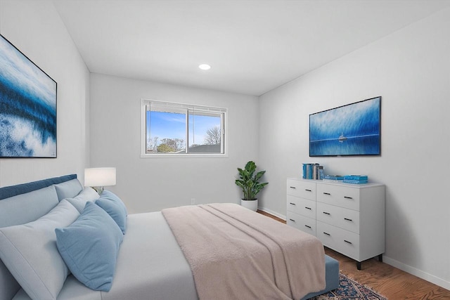 bedroom featuring recessed lighting, wood finished floors, and baseboards