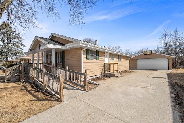 view of front of property with an outdoor structure, a garage, and covered porch