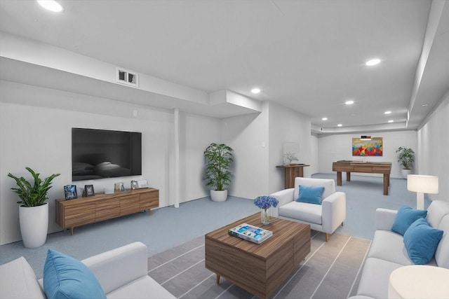 living room featuring recessed lighting, visible vents, and carpet flooring