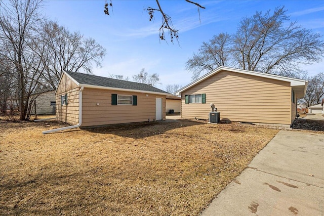 exterior space featuring cooling unit and an outbuilding