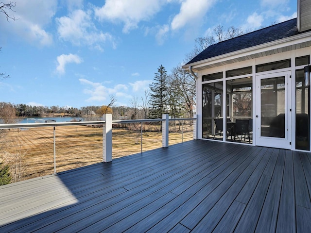 wooden deck featuring a water view and a sunroom