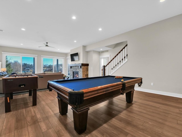 recreation room with a fireplace, billiards, and wood finished floors