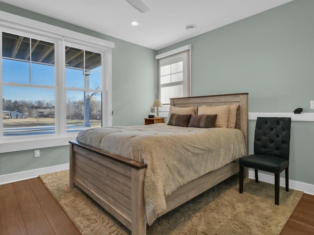 bedroom with visible vents, recessed lighting, wood finished floors, and baseboards