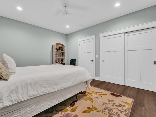 bedroom with dark wood finished floors and recessed lighting