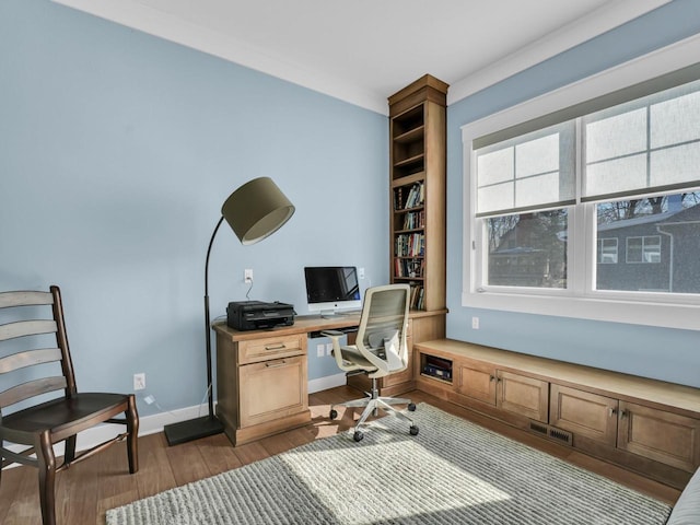 office space featuring dark wood finished floors, visible vents, and baseboards