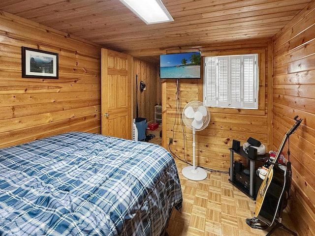 bedroom with wooden ceiling and wood walls