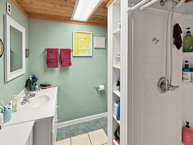 full bathroom featuring vanity, baseboards, tile patterned flooring, wood ceiling, and a shower