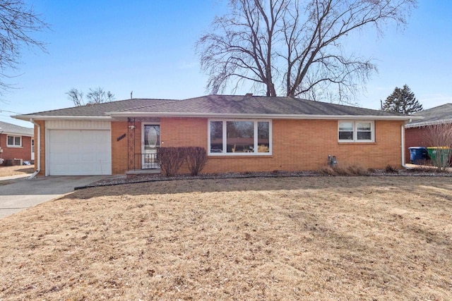 ranch-style house with a garage, brick siding, and driveway