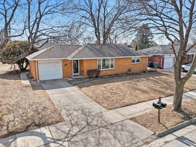 ranch-style house featuring a garage, brick siding, a chimney, and driveway