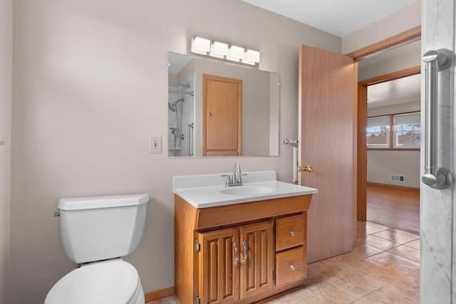 bathroom with vanity, visible vents, walk in shower, tile patterned floors, and toilet