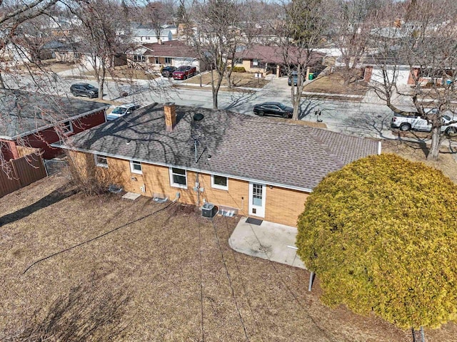 birds eye view of property with a residential view