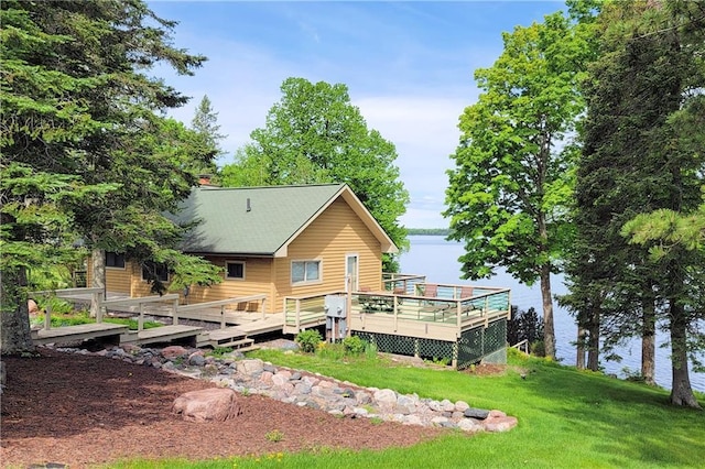 45185 County Highway D, Cable, WI 54821 - back of property with a lawn and a deck with water view