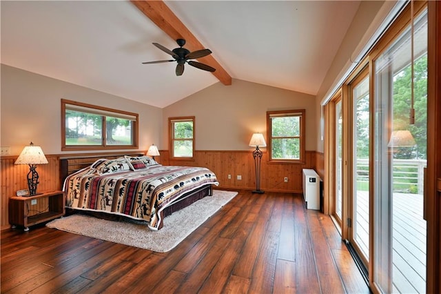 bedroom featuring lofted ceiling with beams, a wainscoted wall, hardwood / wood-style flooring, and access to outside