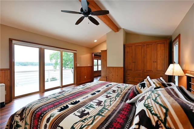 bedroom with access to exterior, wooden walls, lofted ceiling with beams, wainscoting, and wood finished floors