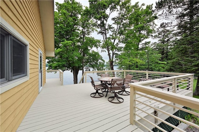 deck with outdoor dining area