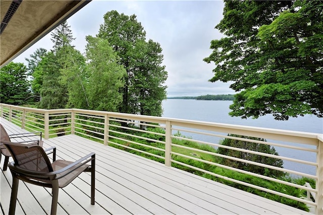 wooden deck featuring a water view