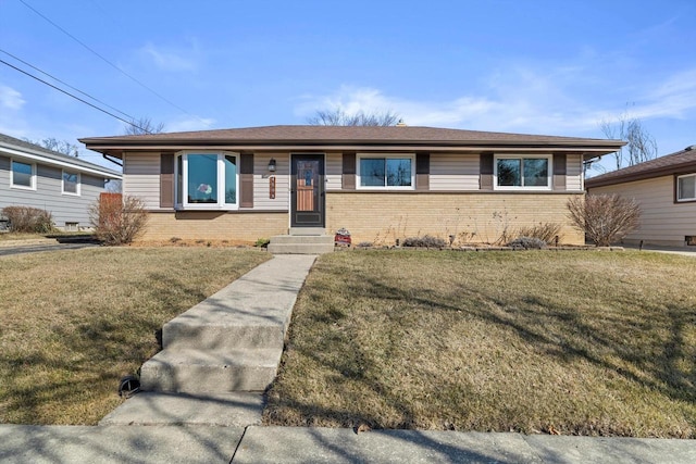 single story home featuring brick siding and a front lawn