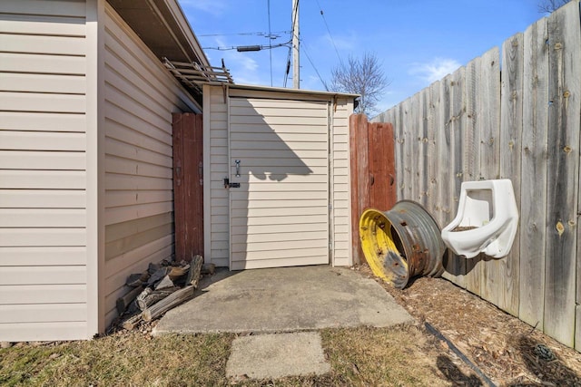 exterior space featuring an outdoor structure and a fenced backyard