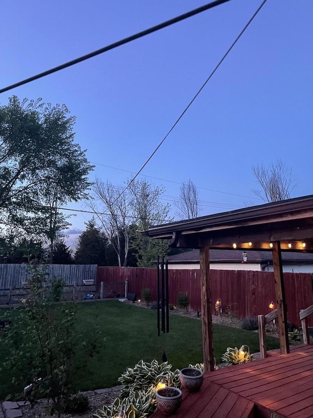 view of yard featuring a deck and fence