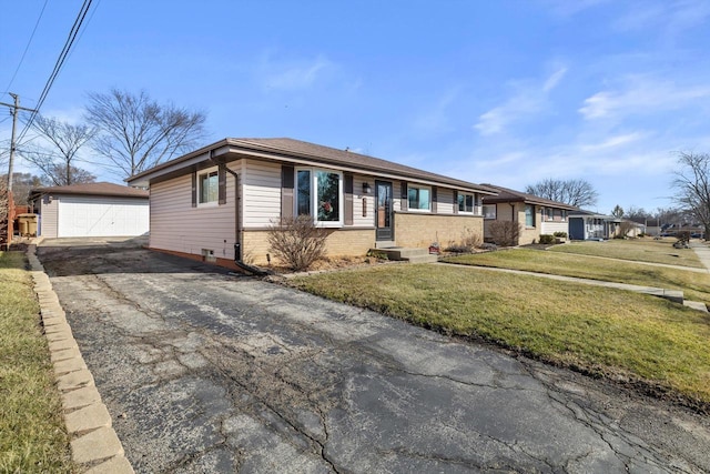 ranch-style house with brick siding, a front yard, a detached garage, and an outdoor structure