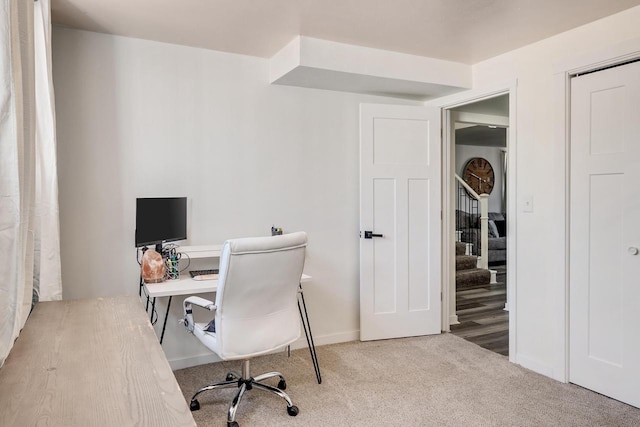 office featuring baseboards and carpet floors