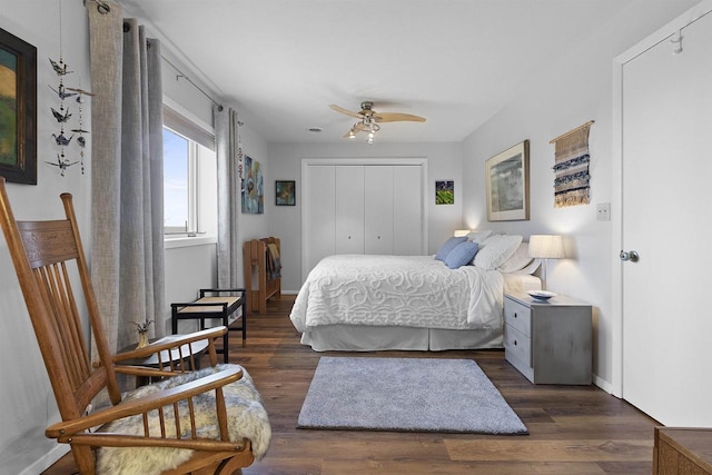 bedroom with a closet, a ceiling fan, baseboards, and wood finished floors