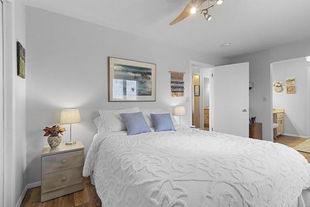 bedroom with wood finished floors, baseboards, and ceiling fan