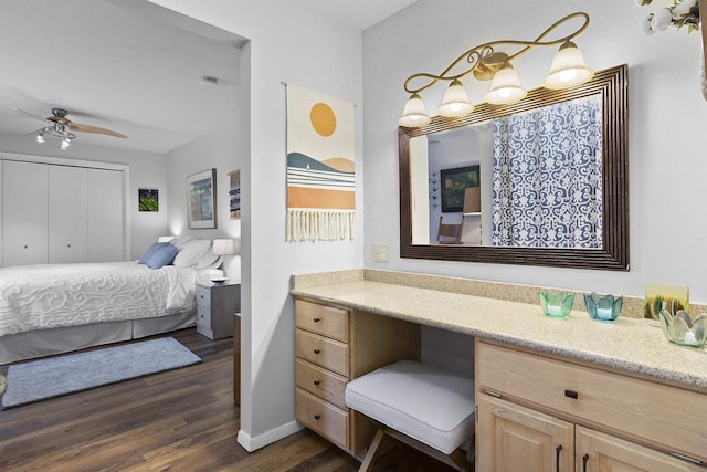 bathroom with wood finished floors, baseboards, and ceiling fan