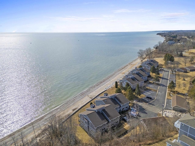 drone / aerial view featuring a view of the beach and a water view