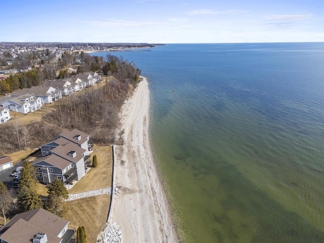 birds eye view of property with a water view and a residential view