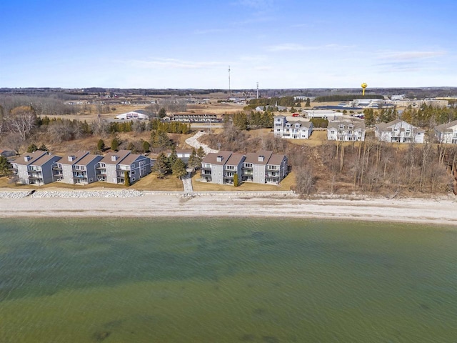 drone / aerial view featuring a residential view and a water view