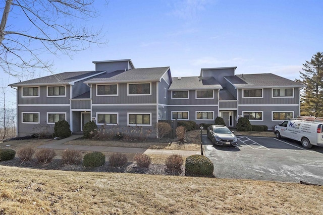 view of property with uncovered parking