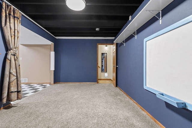 cinema room featuring carpet flooring, baseboards, and visible vents