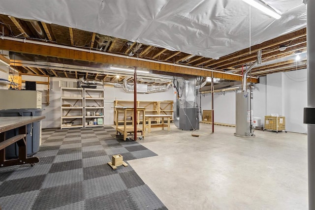 unfinished basement with gas water heater and heating unit