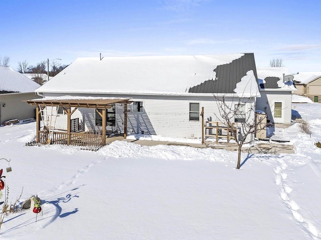 snow covered house featuring a gazebo