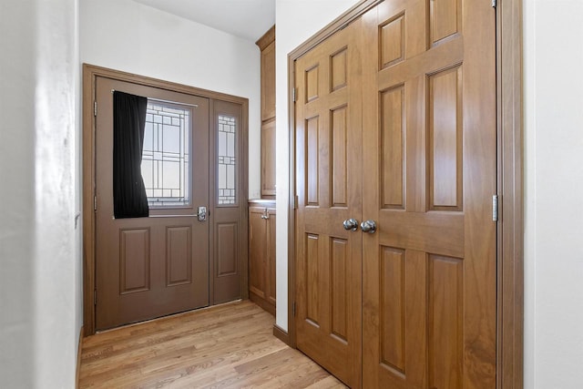 foyer featuring light wood-style floors