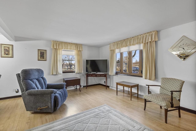 sitting room featuring wood finished floors and baseboards