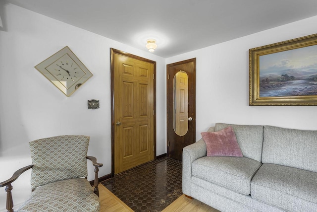 living area featuring baseboards